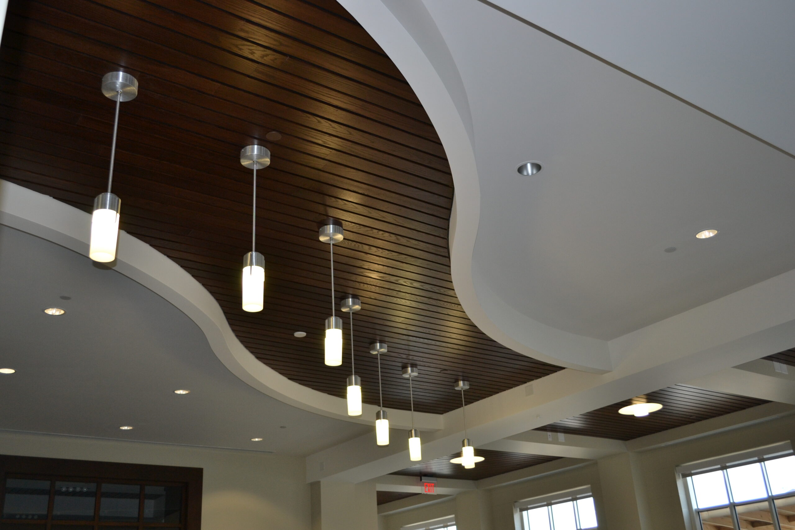 Dark wood laminate ceiling panels.